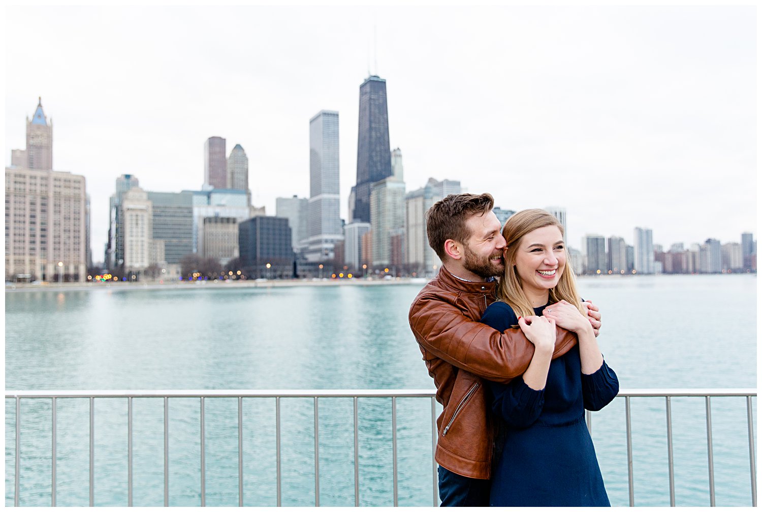 Couple posing for engagement photos at Olive Park in Chicago