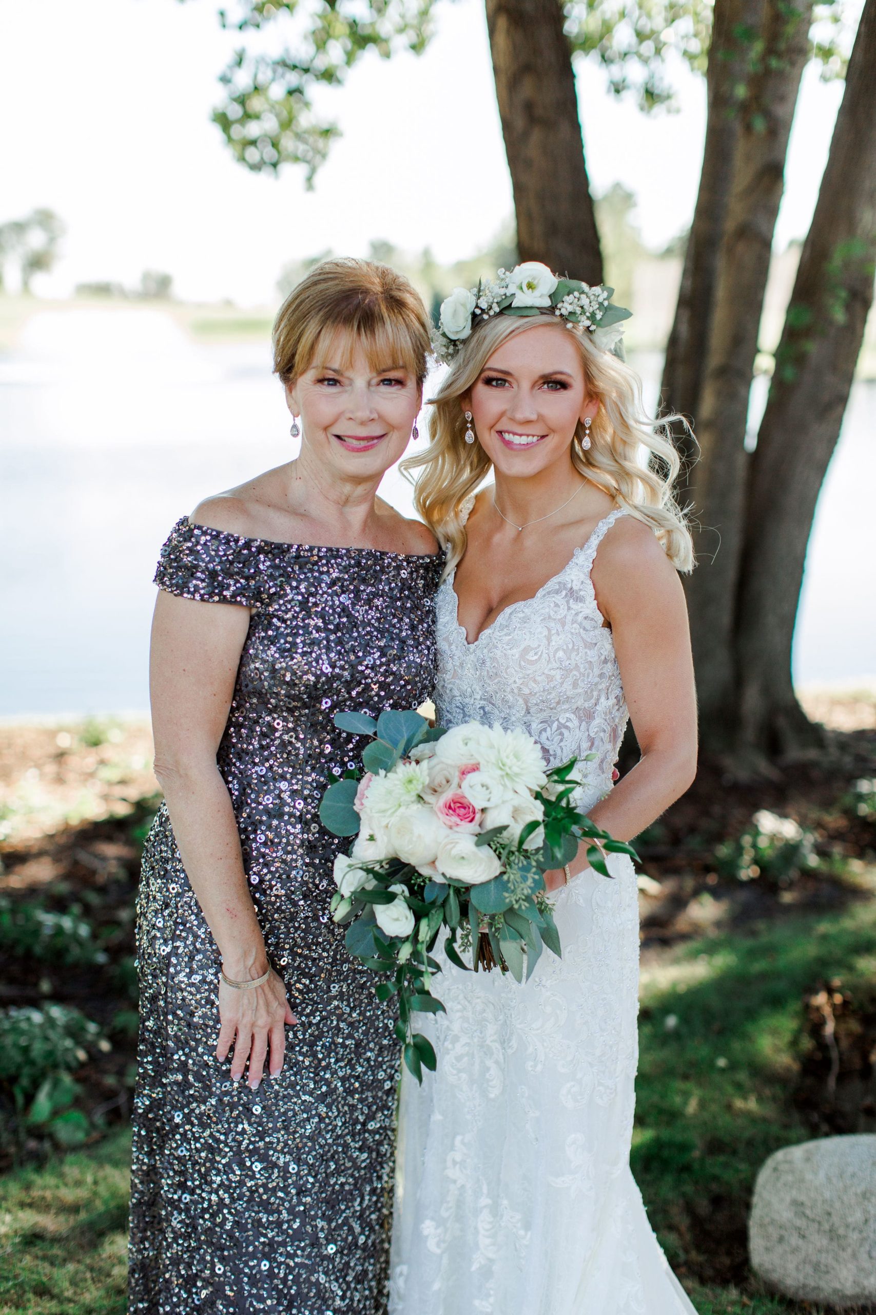 Mother and daughter smiling at camera during family formals at Randall Oaks Golf Club Weddings