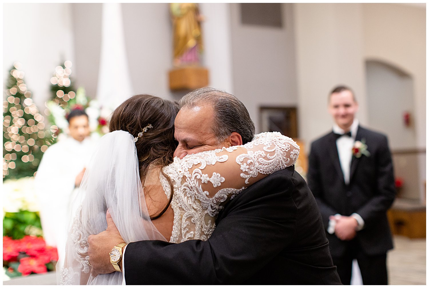 bride's father hugging her
