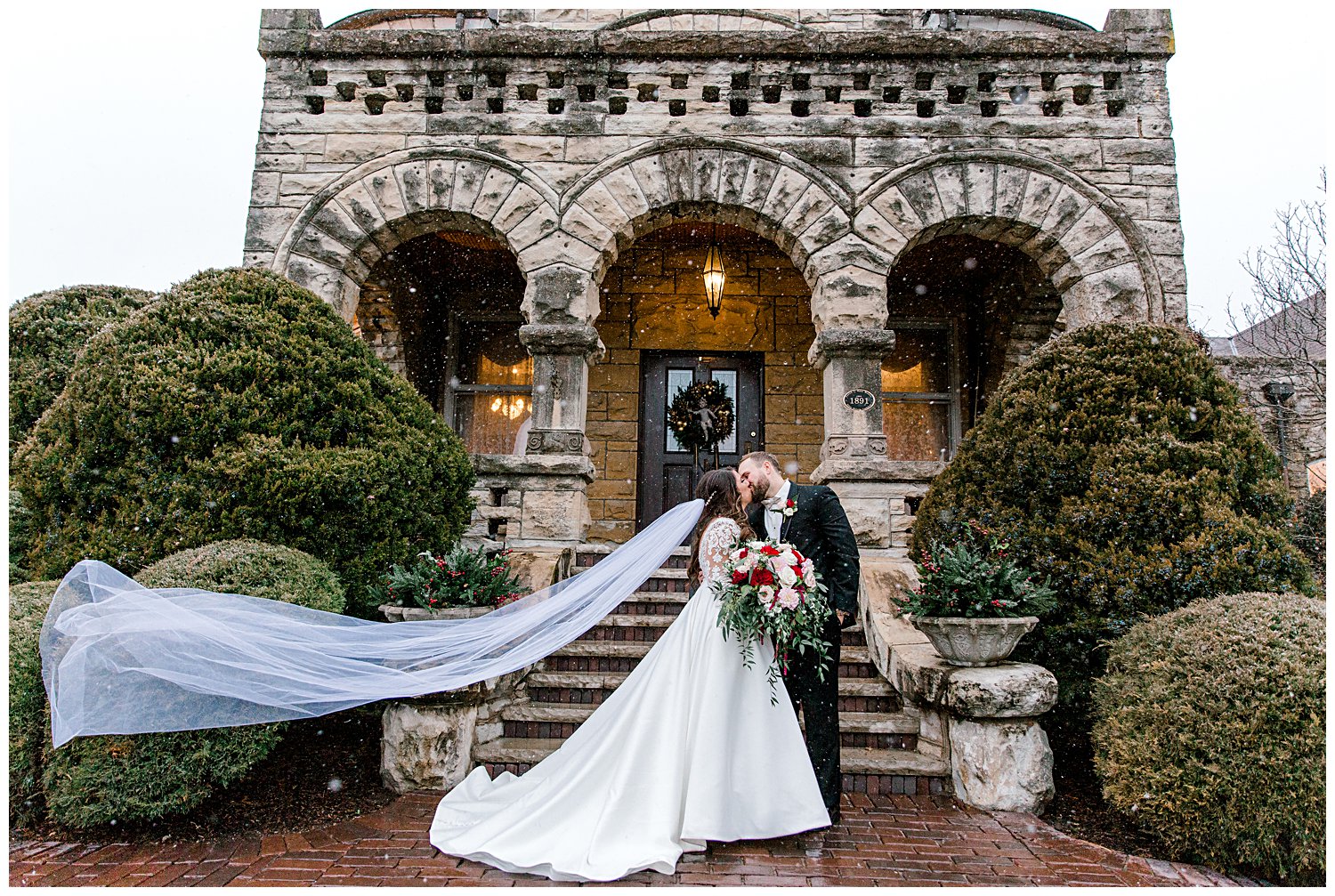 portrait outside Haley Mansion of couple in the snow