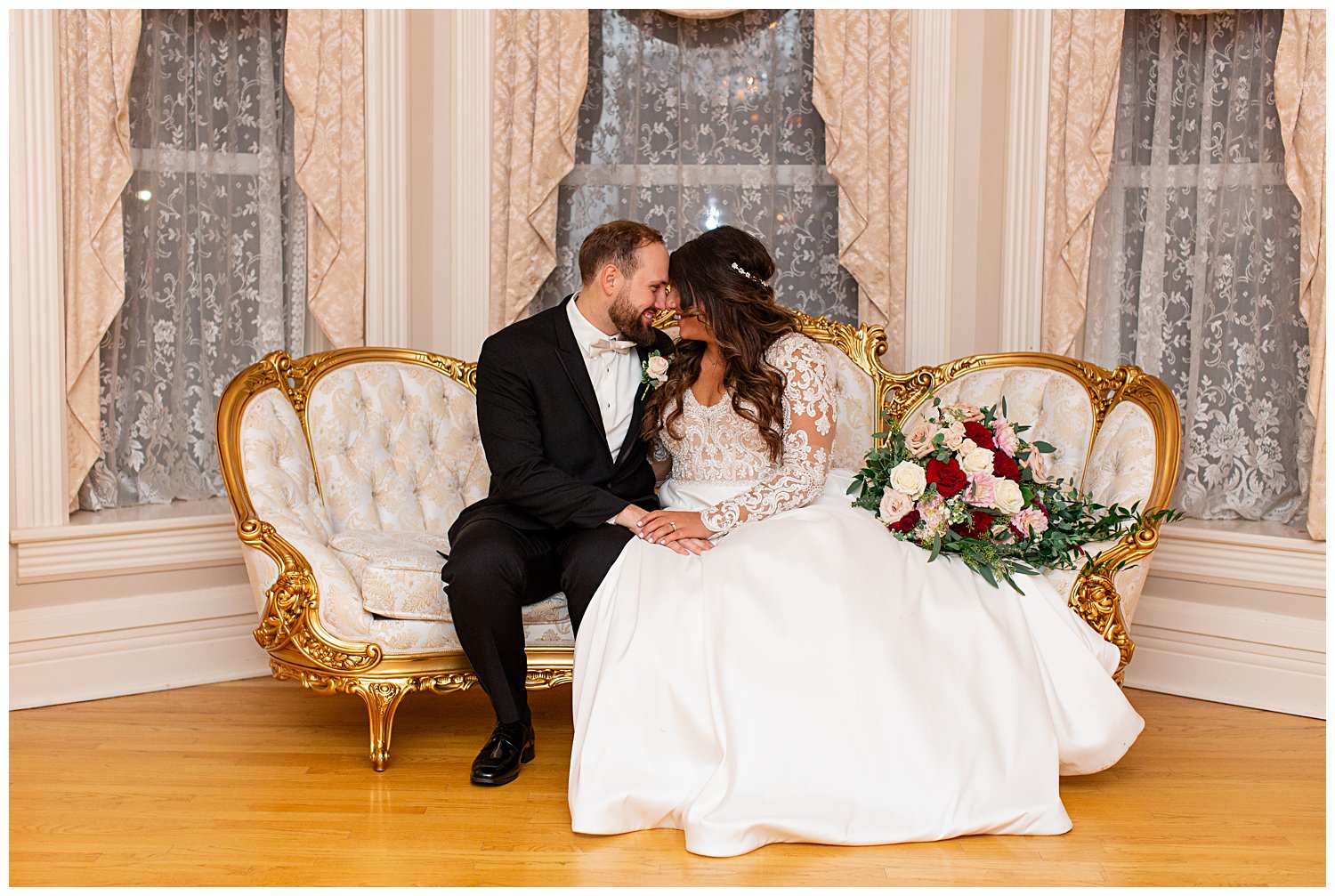 couple sitting on couch at The Haley Mansion