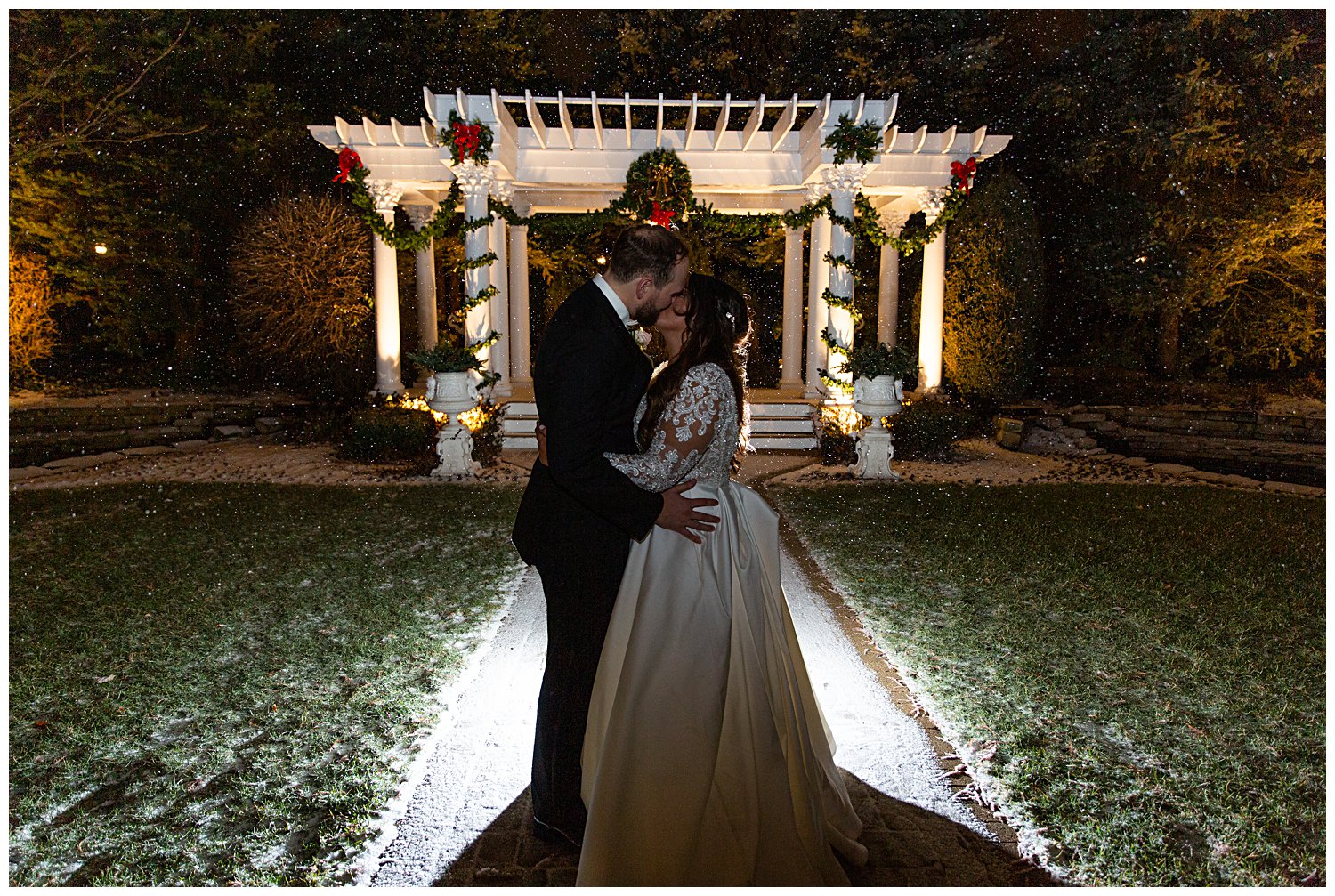 couple kissing outside in the snow at The Haley Mansion