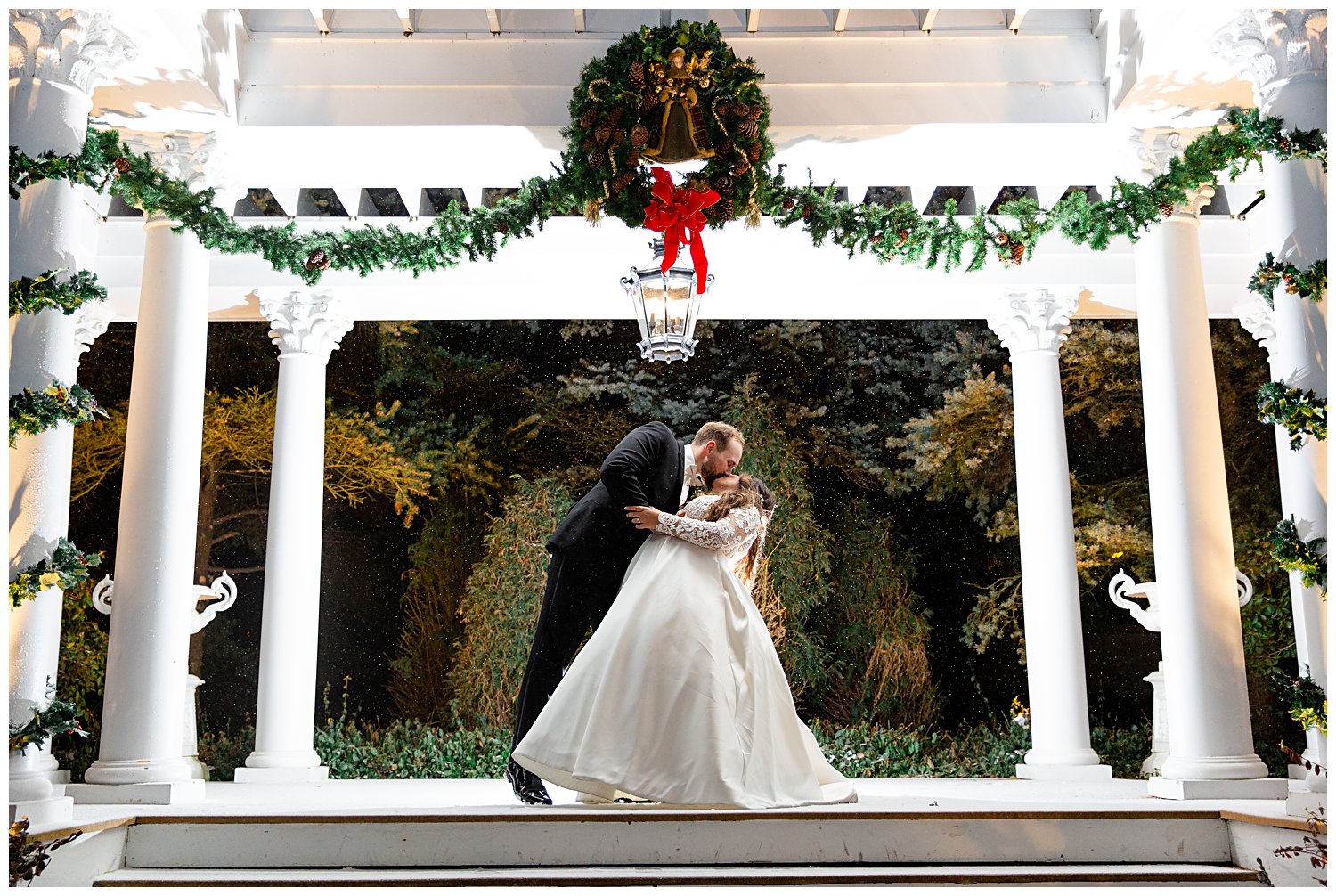 couple kissing outside in the snow at The Haley Mansion