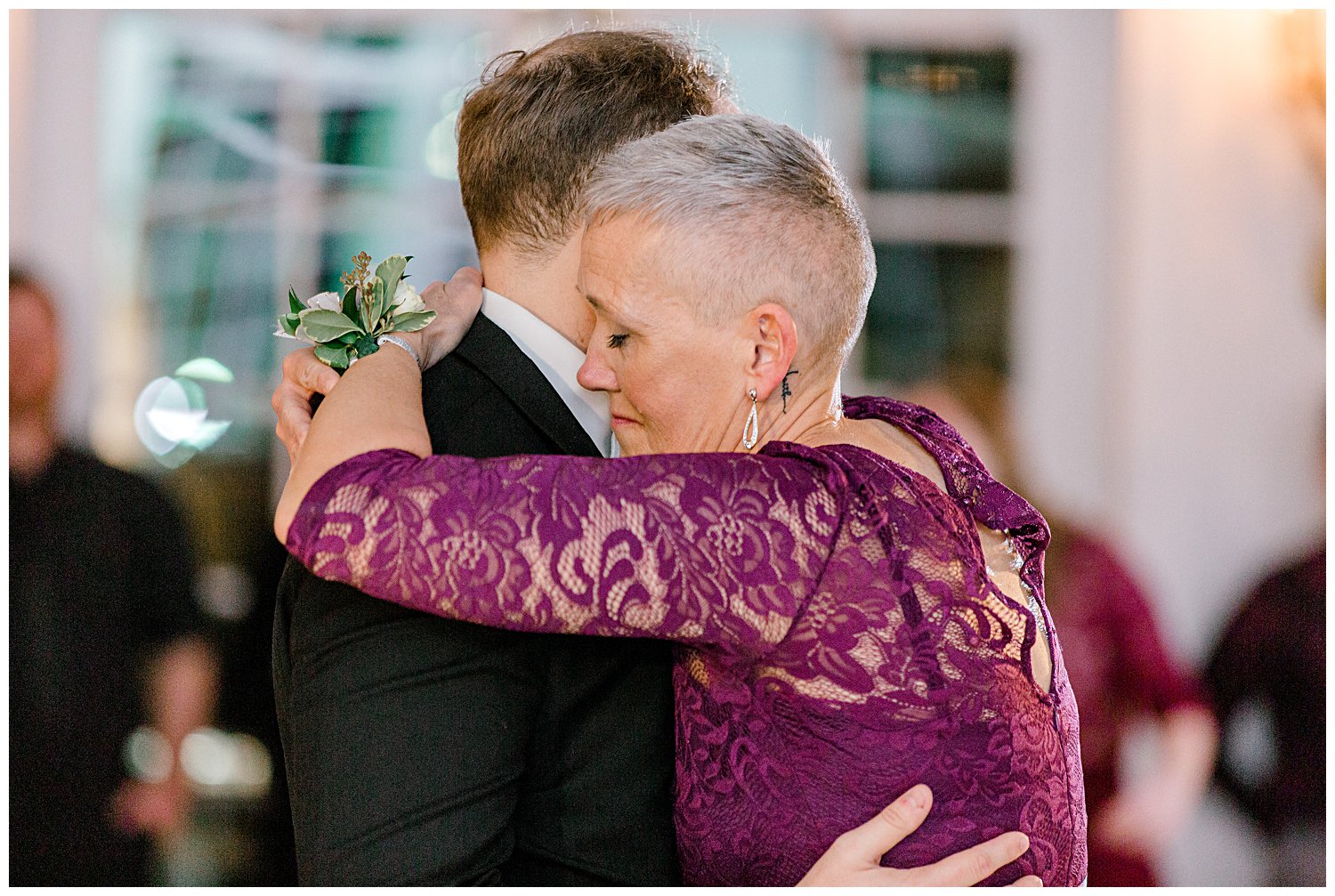 mother of groom and groom dancing