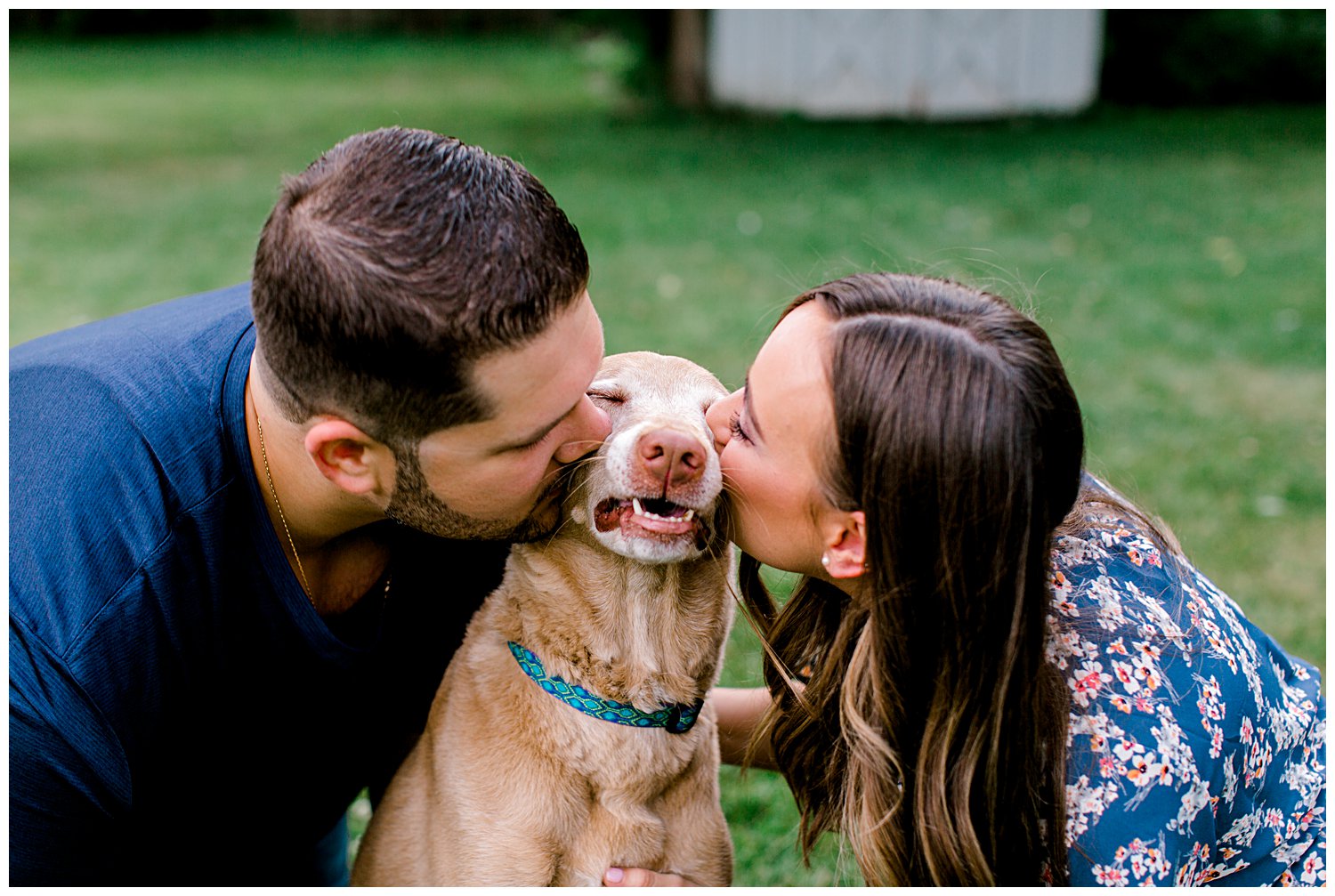 couple kissing their dog during their engagement session